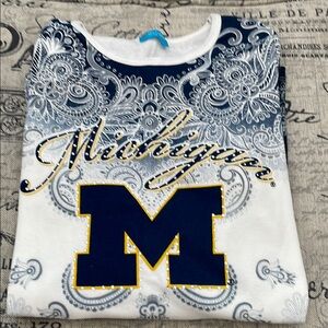 Michigan women’s shirt- Blue , white and maze.
